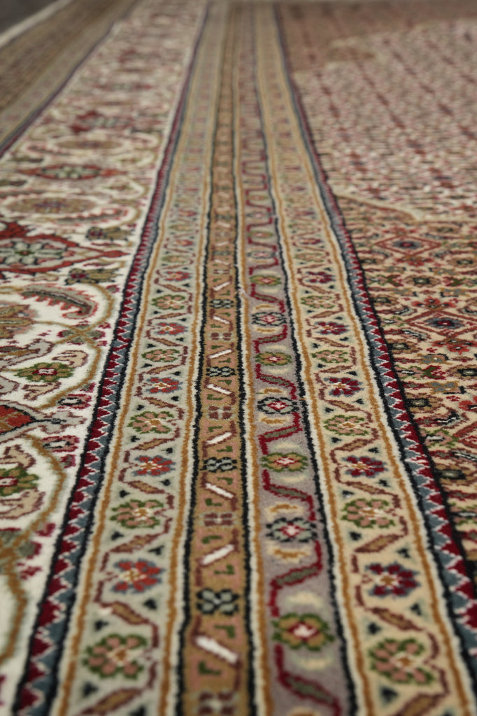 Close-up of a patterned rug with intricate designs.