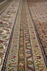 Load image into Gallery viewer, Close-up of a patterned rug with intricate designs.