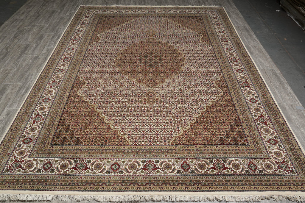Decorative rug with intricate patterns on a concrete floor