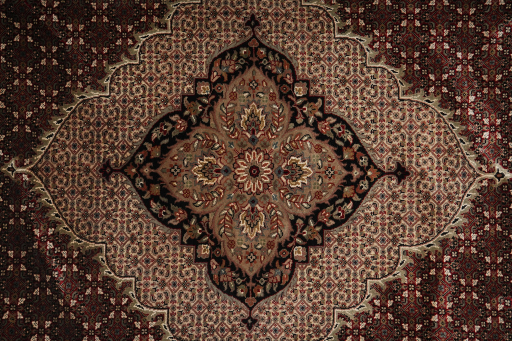 Close-up of a patterned rug with intricate designs