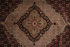 Load image into Gallery viewer, Close-up of a patterned rug with intricate designs