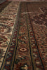 Load image into Gallery viewer, Close-up of a patterned rug with intricate designs.