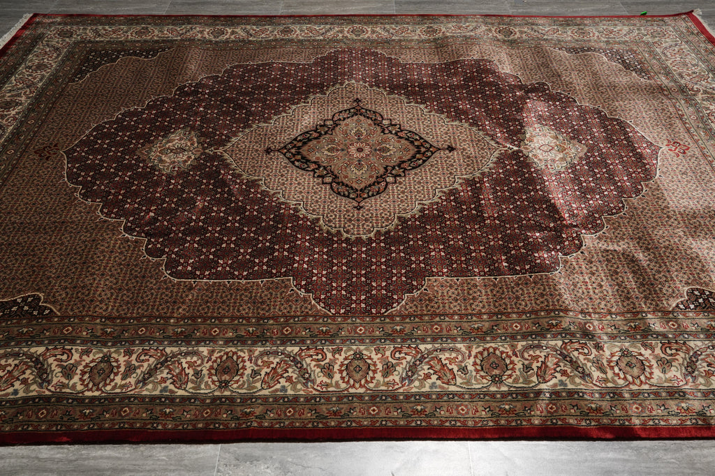 Decorative rug with intricate patterns on a wooden floor