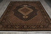 Load image into Gallery viewer, Brown patterned rug on a wooden floor