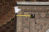 Load image into Gallery viewer, Measurement tape on a patterned rug with a visible size label.