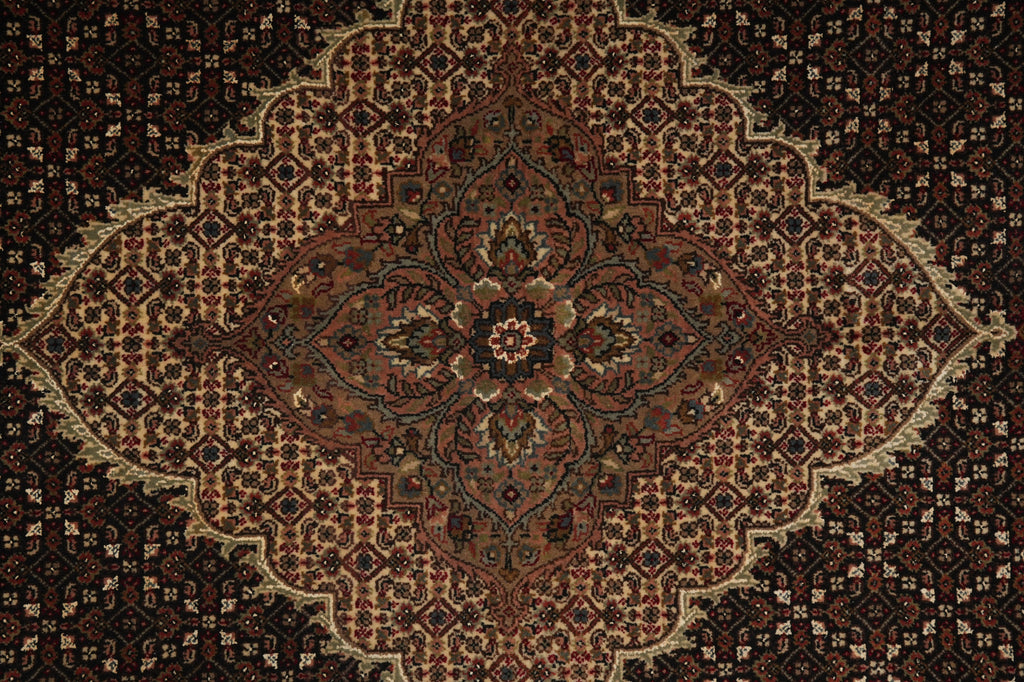 Close-up of a patterned rug with intricate designs.