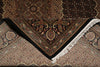 Load image into Gallery viewer, Close-up of a patterned rug with intricate designs and fringes.