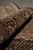 Load image into Gallery viewer, Close-up of a patterned rug with intricate designs.