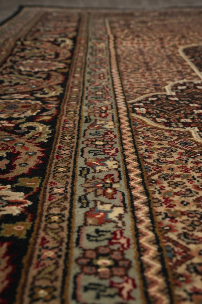 Close-up of a patterned rug with intricate designs.
