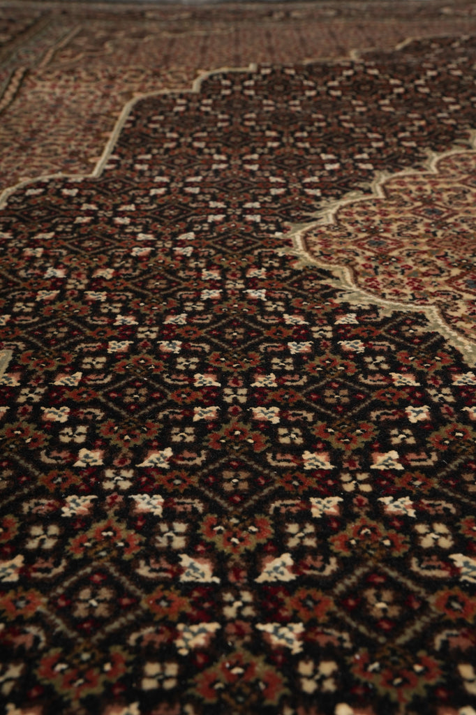 Close-up of a patterned rug with intricate designs.