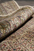 Load image into Gallery viewer, Roll of patterned fabric with intricate designs on a plain background