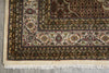 Load image into Gallery viewer, Close-up of a patterned rug with intricate designs on a neutral background