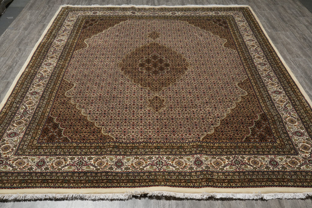 Decorative rug with intricate patterns on a wooden floor