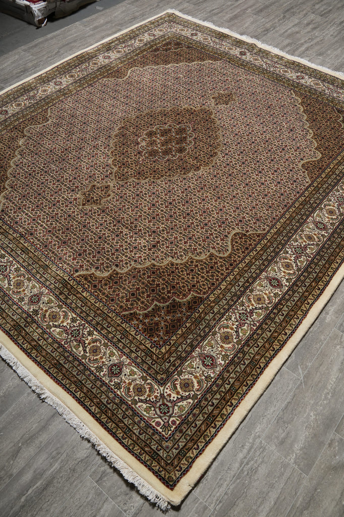 Decorative rug with intricate patterns on a wooden floor