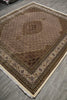 Load image into Gallery viewer, Decorative rug with intricate patterns on a wooden floor