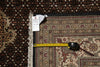 Load image into Gallery viewer, Patterned rug with a measuring tape and 
a size tag