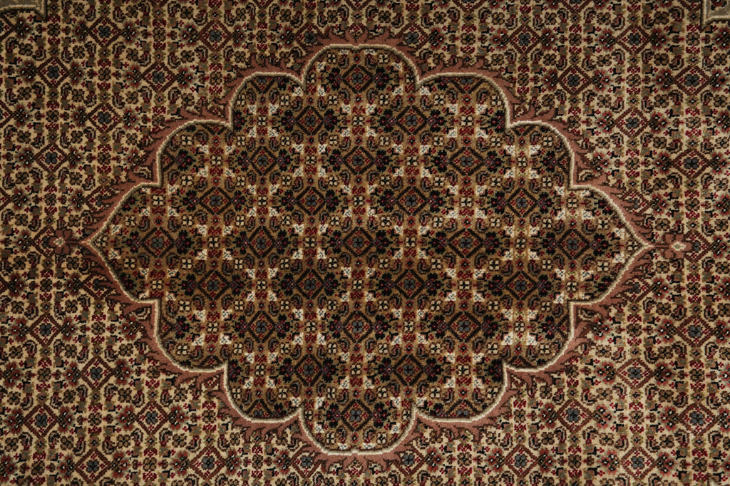 Close-up of a patterned rug with intricate designs.