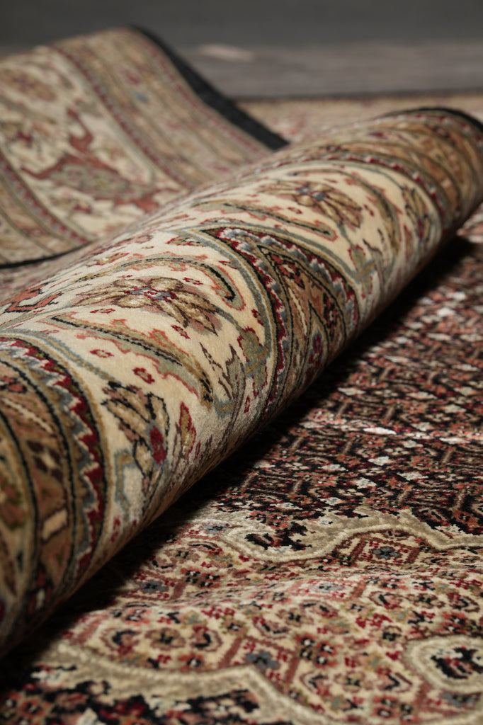 Close-up of a patterned rug with intricate designs.