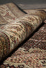Load image into Gallery viewer, Close-up of a patterned rug with intricate designs.