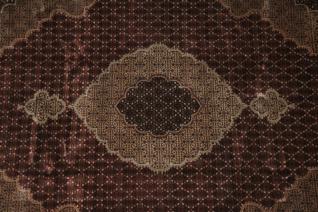 Close-up of a patterned rug with intricate designs.