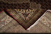 Load image into Gallery viewer, Close-up of a patterned rug with intricate designs.