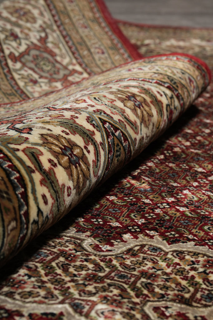 Close-up of a patterned rug with a focus on texture and color.
