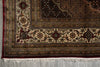 Load image into Gallery viewer, Close-up of an ornate rug with intricate patterns on a concrete floor.