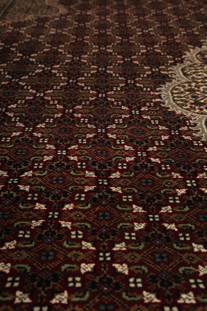 Close-up of a patterned rug with intricate designs.
