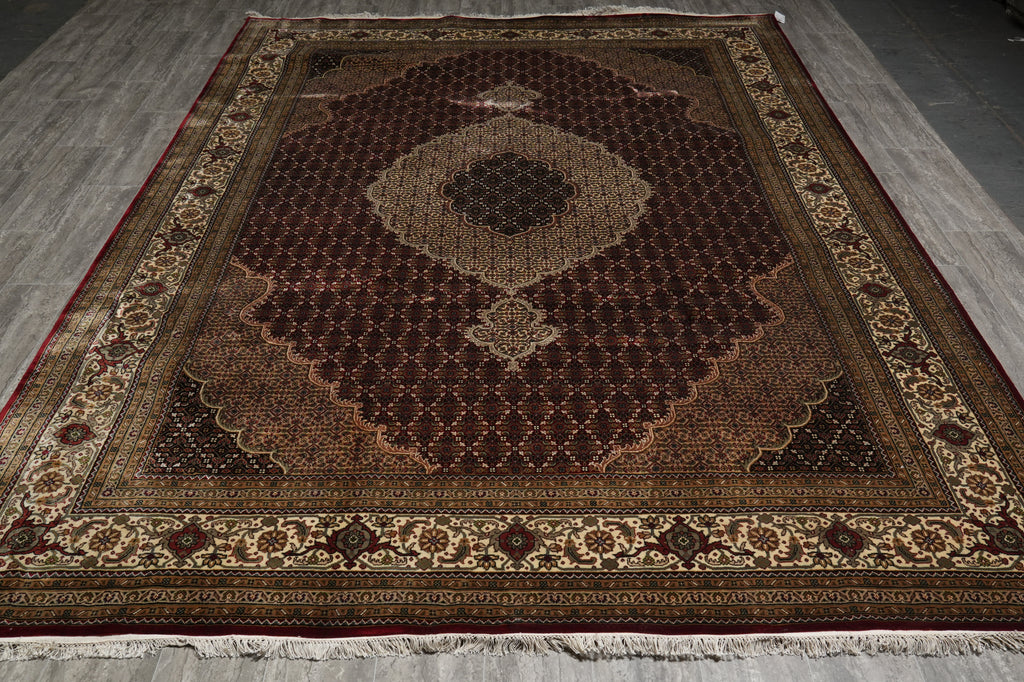 Decorative rug with intricate patterns on a plain floor