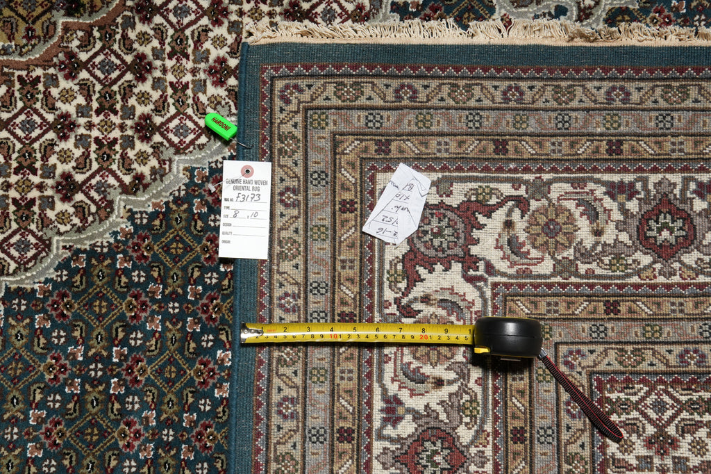 Patterned rug with a measuring tape and size tag