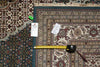 Load image into Gallery viewer, Patterned rug with a measuring tape and size tag