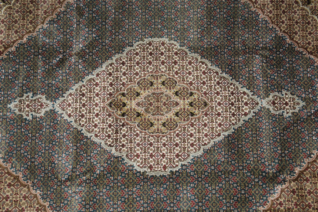 Close-up of a patterned rug with intricate designs.