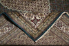 Load image into Gallery viewer, Close-up of a patterned rug with intricate designs.