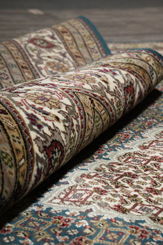 Close-up of a patterned rug with intricate designs.