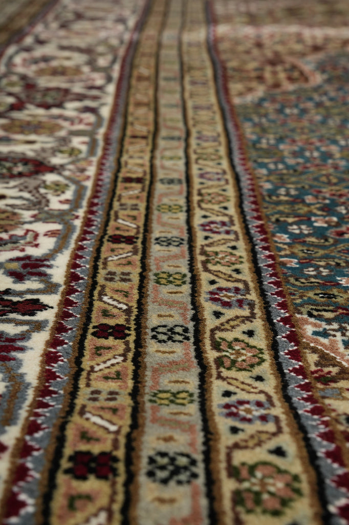 Close-up of a patterned rug with intricate designs.