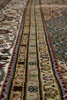 Load image into Gallery viewer, Close-up of a patterned rug with intricate designs.
