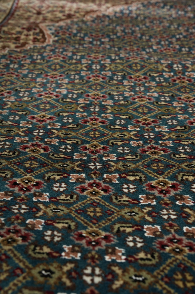 Close-up of a patterned rug with intricate designs.