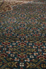 Load image into Gallery viewer, Close-up of a patterned rug with intricate designs.