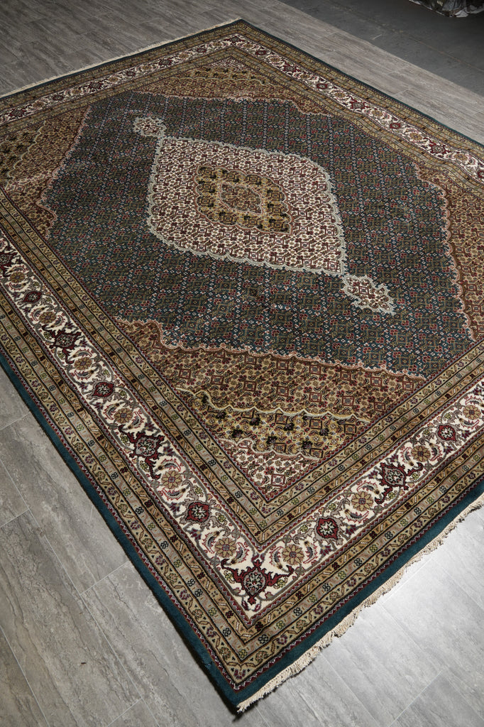 Decorative rug with intricate patterns on a wooden floor