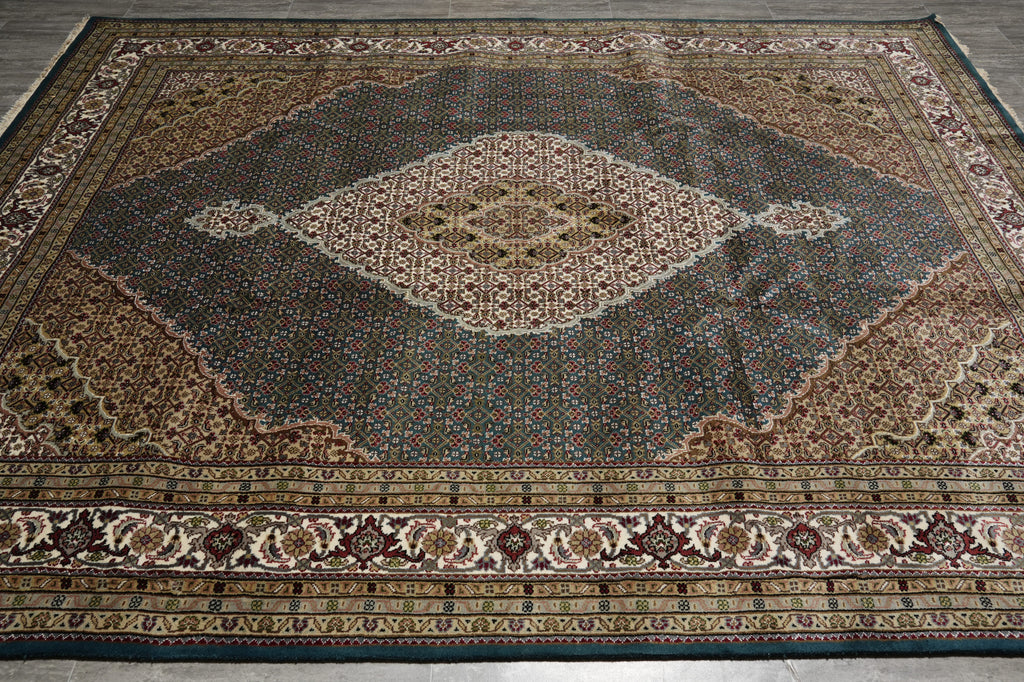 Decorative rug with intricate patterns on a wooden floor