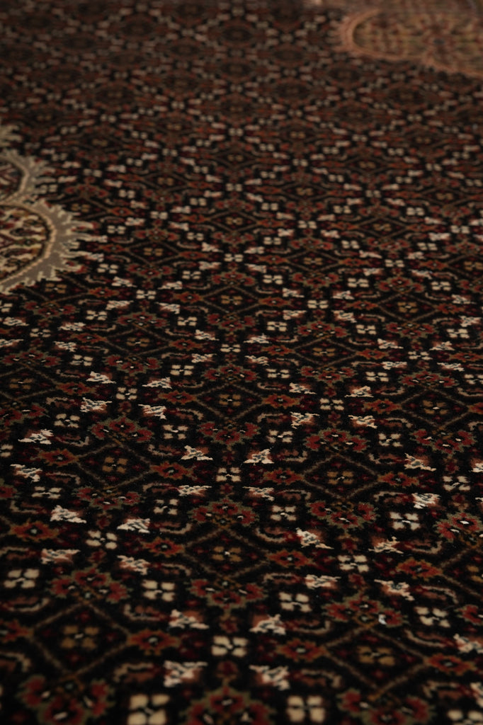 Close-up of a patterned rug with intricate designs.