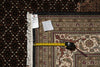 Load image into Gallery viewer, Patterned rug with a measuring tape and a size tag