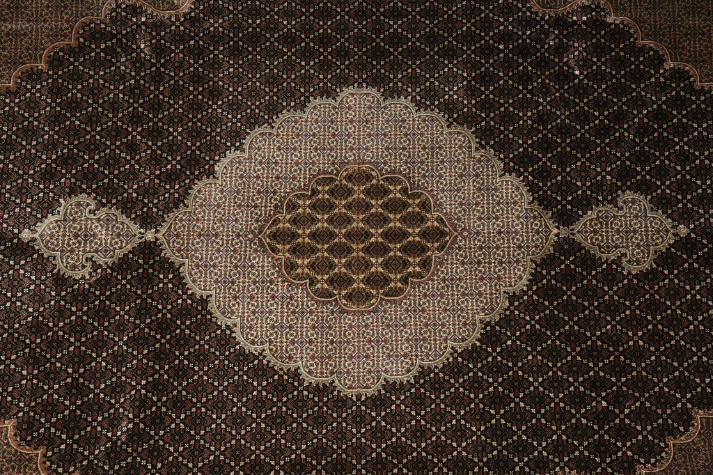 Close-up of a patterned brown rug with geometric design