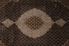 Load image into Gallery viewer, Close-up of a patterned brown rug with geometric design