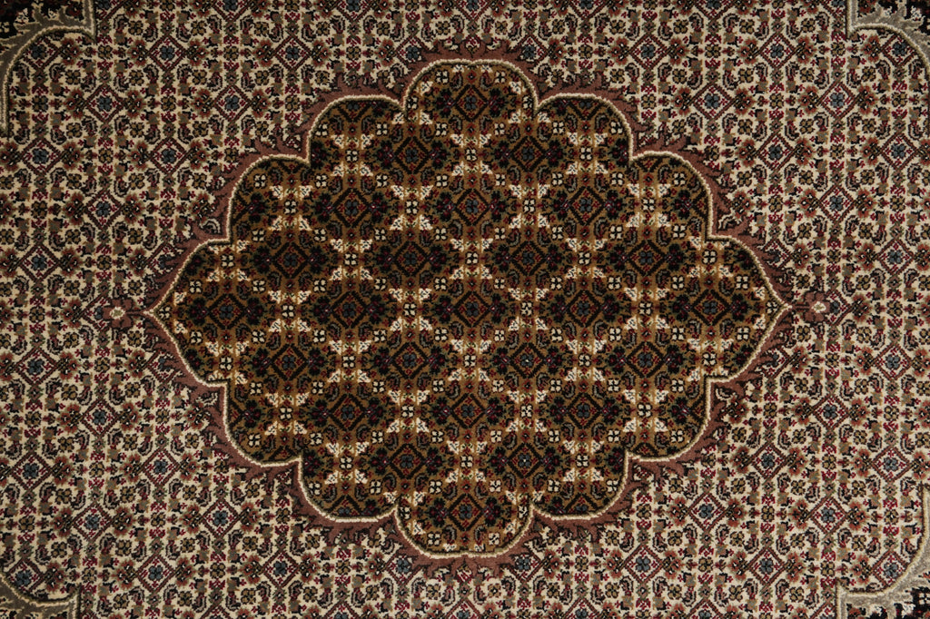 Close-up of a patterned rug with intricate design