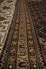 Load image into Gallery viewer, Close-up of a patterned rug with intricate designs.