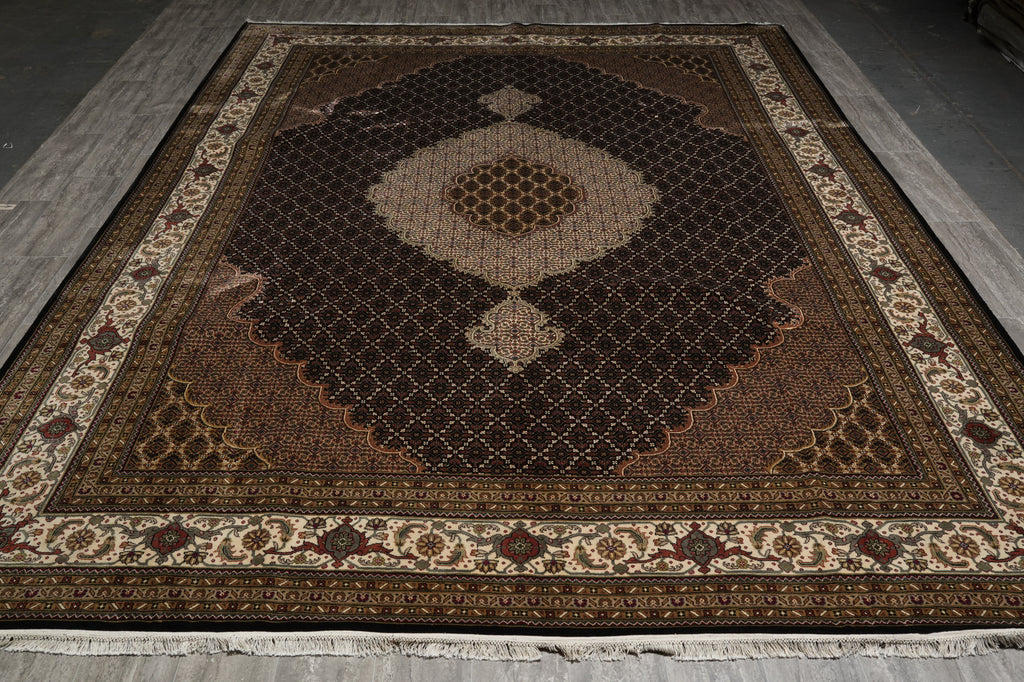 Decorative rug with intricate patterns on a wooden floor.