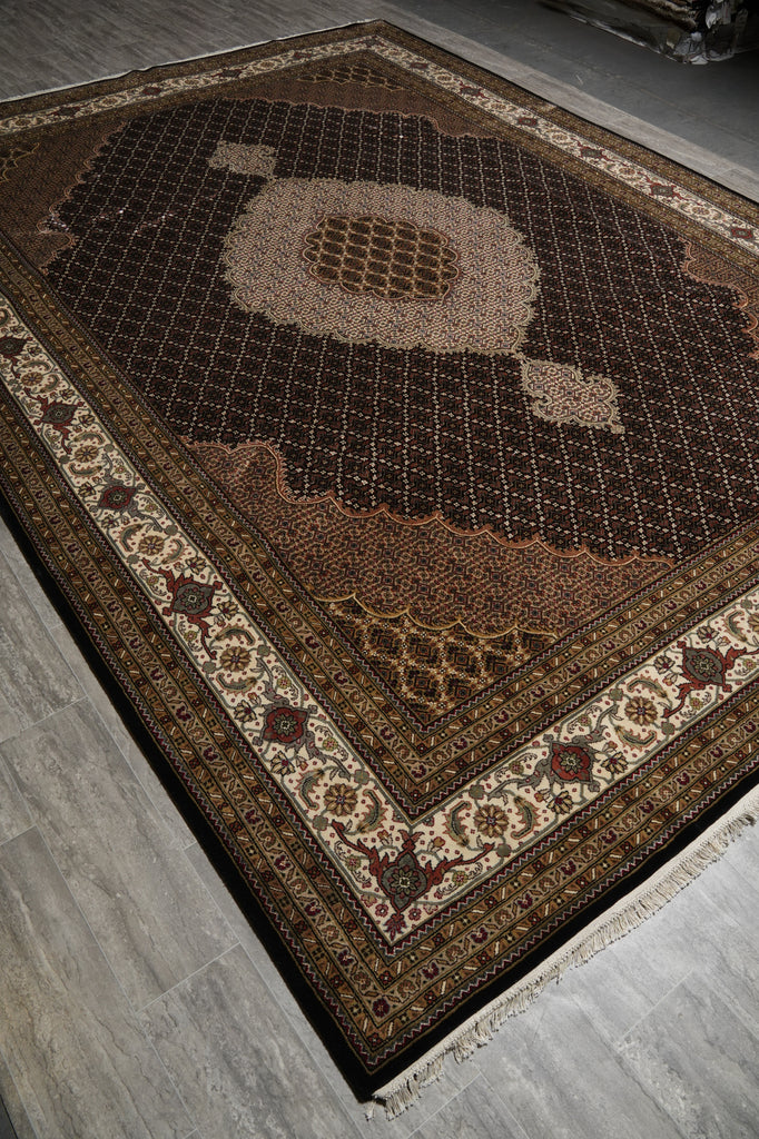 Decorative rug with intricate patterns on a gray floor