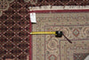 Load image into Gallery viewer, Patterned rug with a measuring tape and a tag on it
