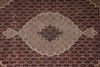 Load image into Gallery viewer, Close-up of a patterned rug with intricate designs on a brown background